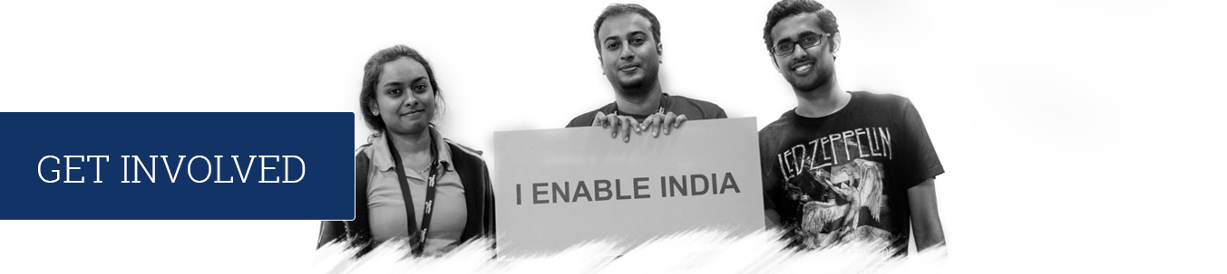 Volunteers holding placard that reads I enable india.