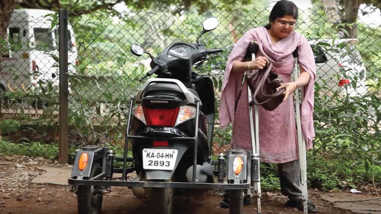 Sunita - Gritty cashier on a three wheeler